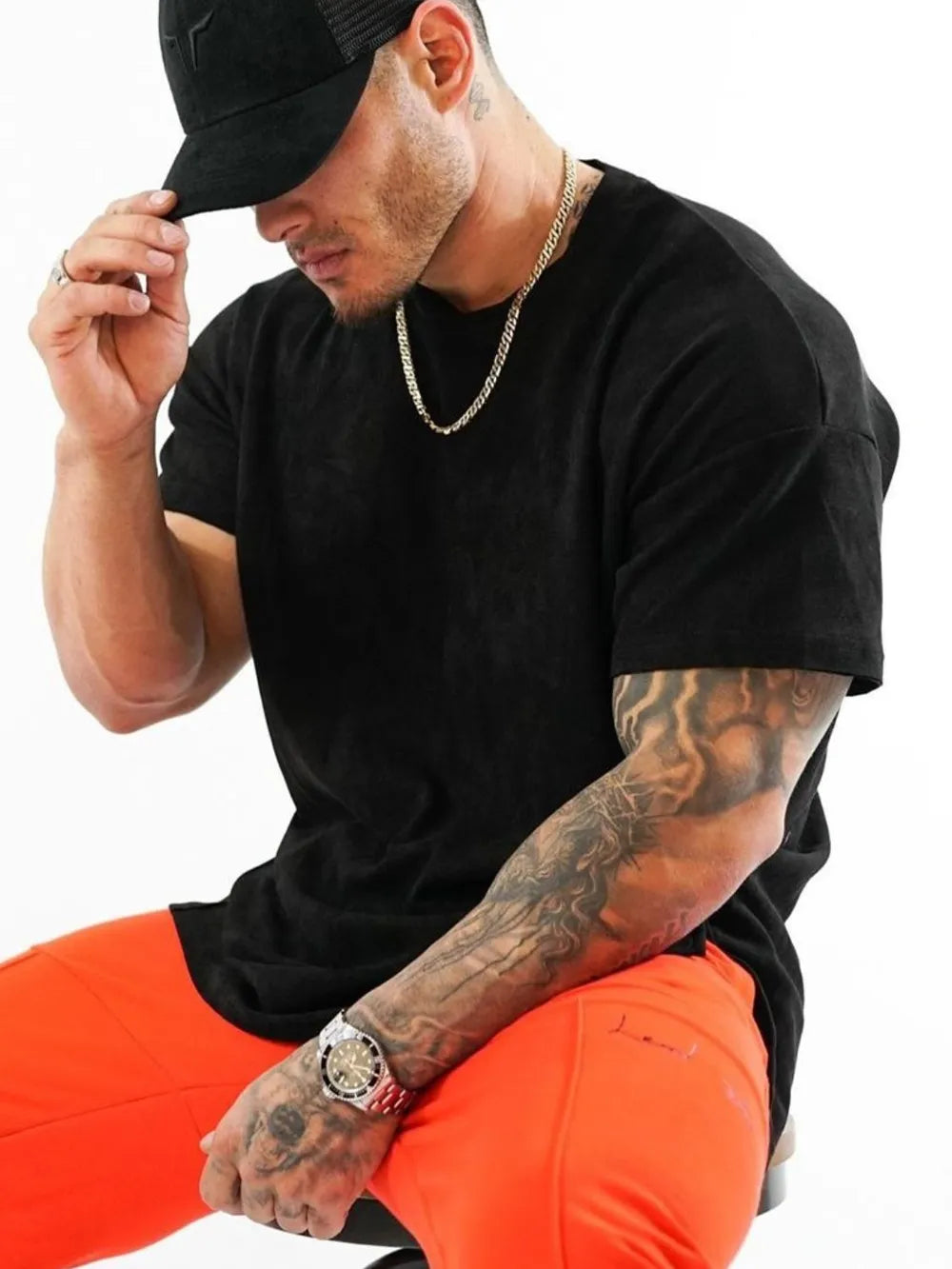 Black oversized crew neck tee with textured fabric and short sleeves.