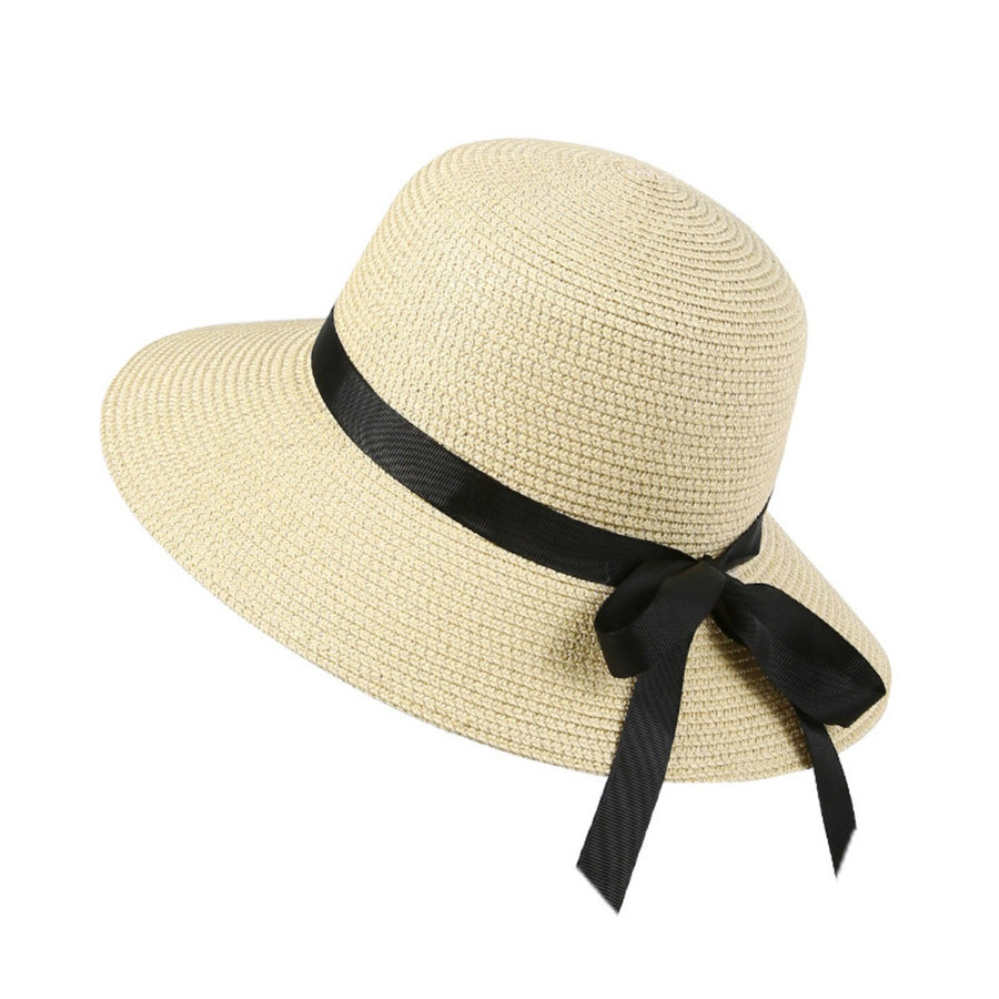 Beige straw sun hat with wide brim and black bow detail.