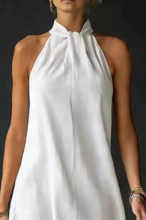 White cotton blend maxi dress with twisted halter neckline and a-line cut.