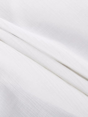 White textured fabric with subtle vertical lines.