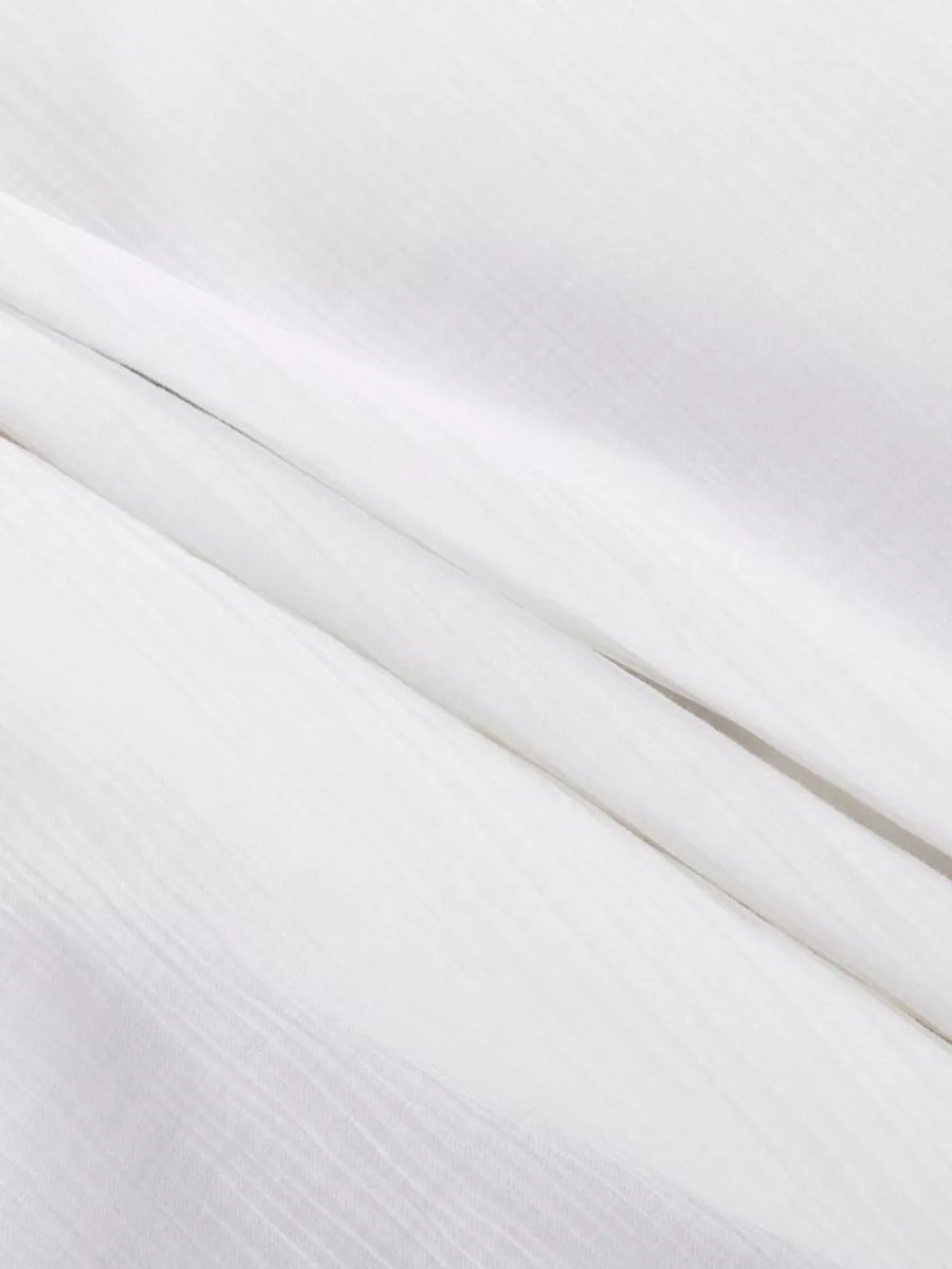 White textured fabric with subtle vertical lines.