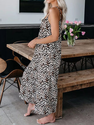 Maxi dress with spaghetti straps and leopard print in black and tan.