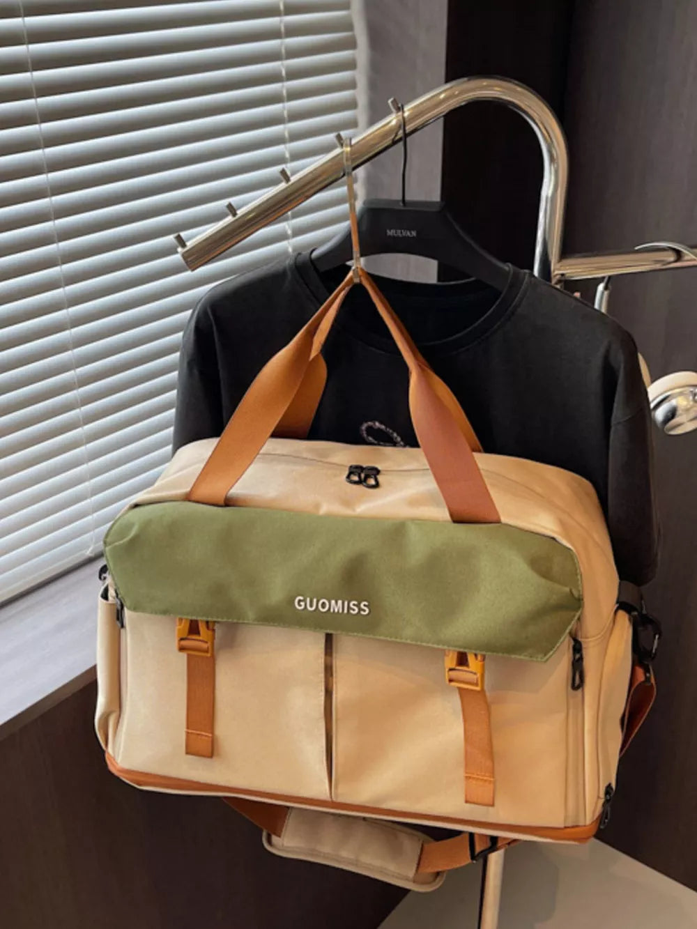 Chic nylon travel bag with olive flap and tan accents, featuring multiple pockets and buckle closures.