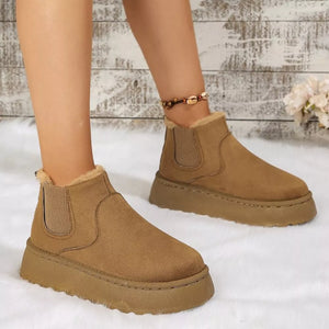 Caramel suede round toe platform ankle boots with faux fur lining and elastic side panels.