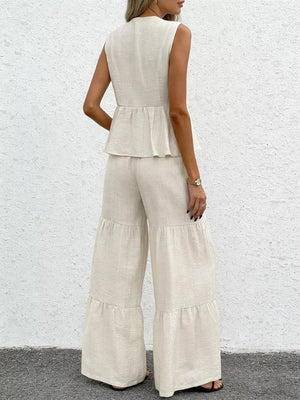Beige ruffled peplum sleeveless top with tiered wide-leg pants set.