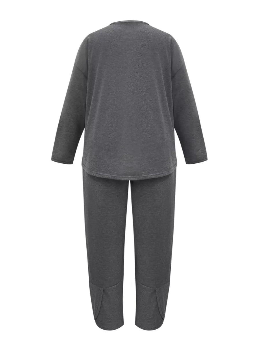 Plus size dark gray crew neck lounge set with long sleeves and split hem pants.
