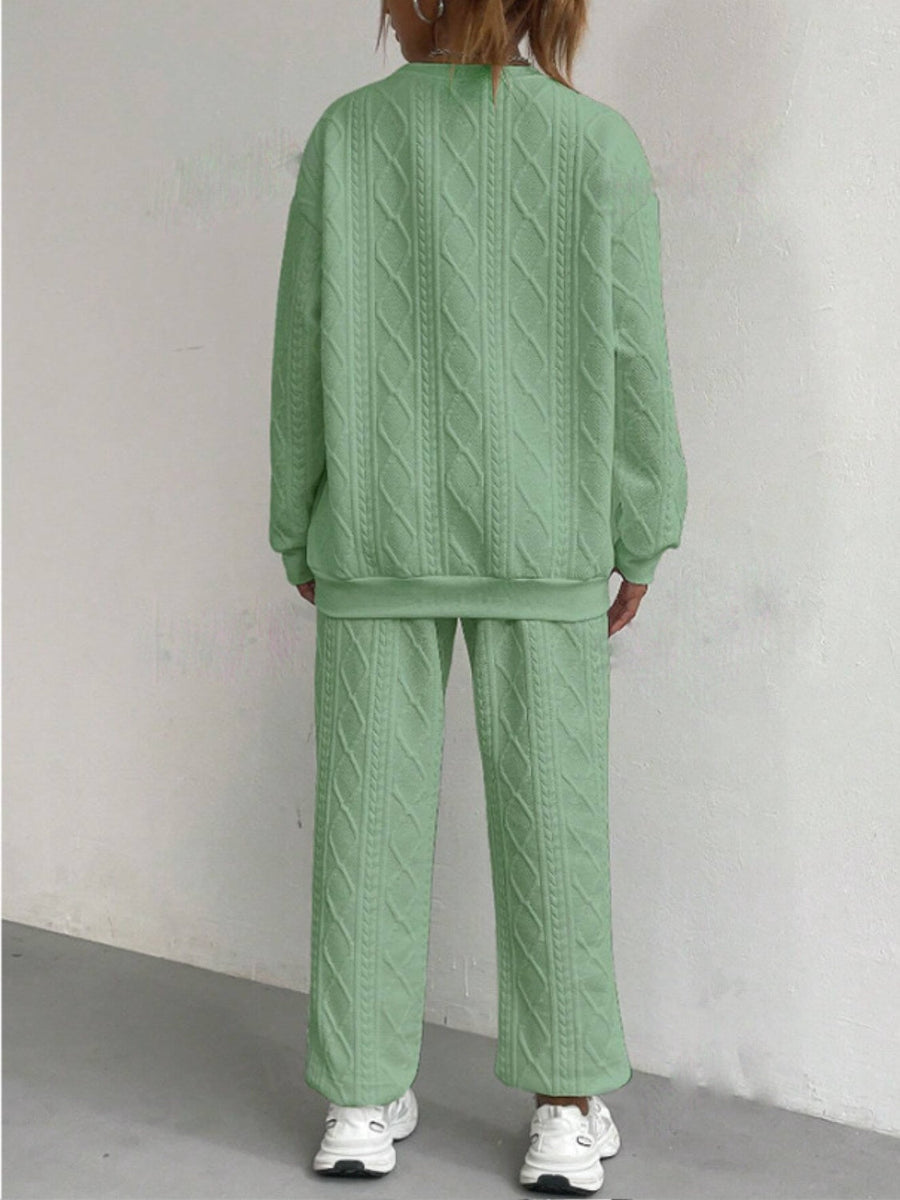 Textured cable knit loungewear set in Gum Leaf green, featuring a crewneck sweatshirt and wide-leg pants.