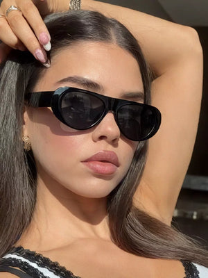 sunglasses in black featuring UV protection and oval fit
