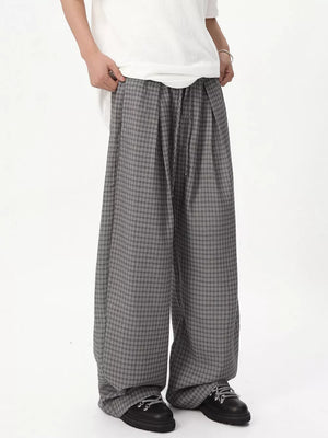 Grey plaid wide-leg joggers with adjustable drawstring waist.