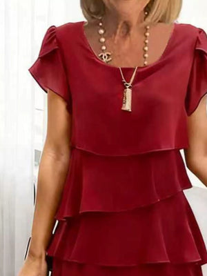 Burgundy ruffled tiered petal sleeve dress with a scoop neck and layered skirt.