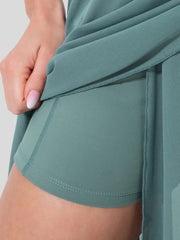 Flowy midi skirt with shorts liner in light blue, showing mesh overlay and comfortable inner shorts.