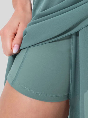 Flowy midi skirt with shorts liner in light blue, showing mesh overlay and comfortable inner shorts.