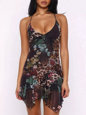 Floral asymmetrical mini dress with ruffled hem and animal print detail.