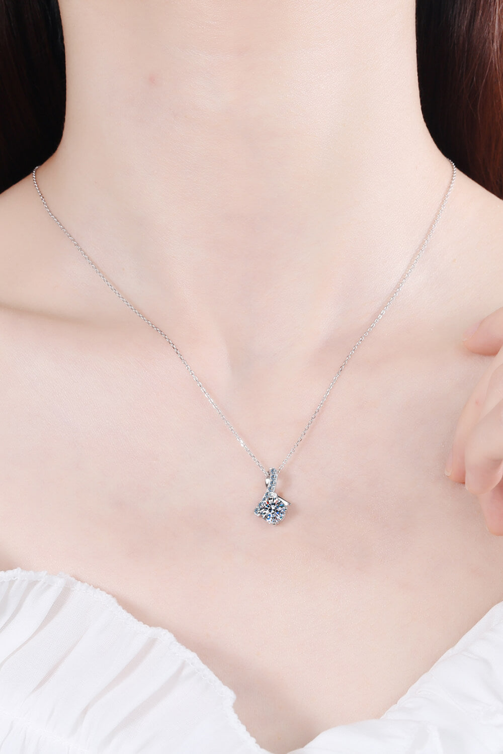 Silver solitaire pendant necklace with diamond accents
