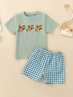 Baby set with duck embroidery on mint green tee and blue gingham shorts.