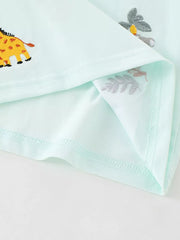 Light blue baby polo shirt with embroidered giraffe and botanical details.