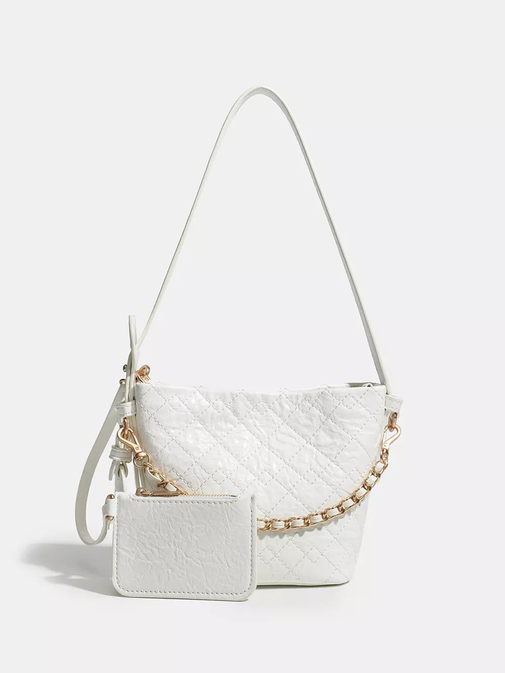 White quilted bucket bag with gold chain accent and matching card holder