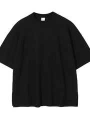 Black waffle knit boxy t-shirt with crew neck and short sleeves.