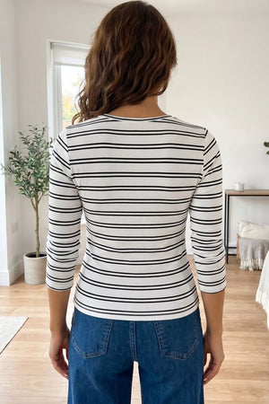 Striped knit top with 3/4 sleeves and a crew neck.