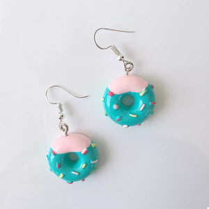 Teal donut dangle earrings with pink frosting and colorful sprinkles.