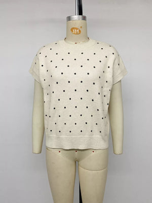 cream pullover sweater with ribbed cuffs and short sleeve