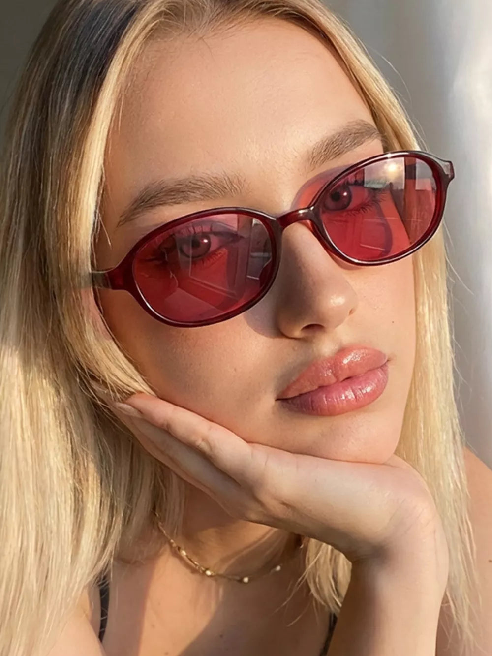 sunglasses in burgundy featuring UV protection and oval fit