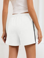 Heathered jogger shorts in gray with sporty black side trim and drawstring waist.