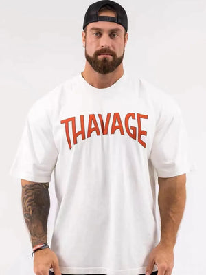 White oversized graphic tee with red THAVAGE print and short sleeves.
