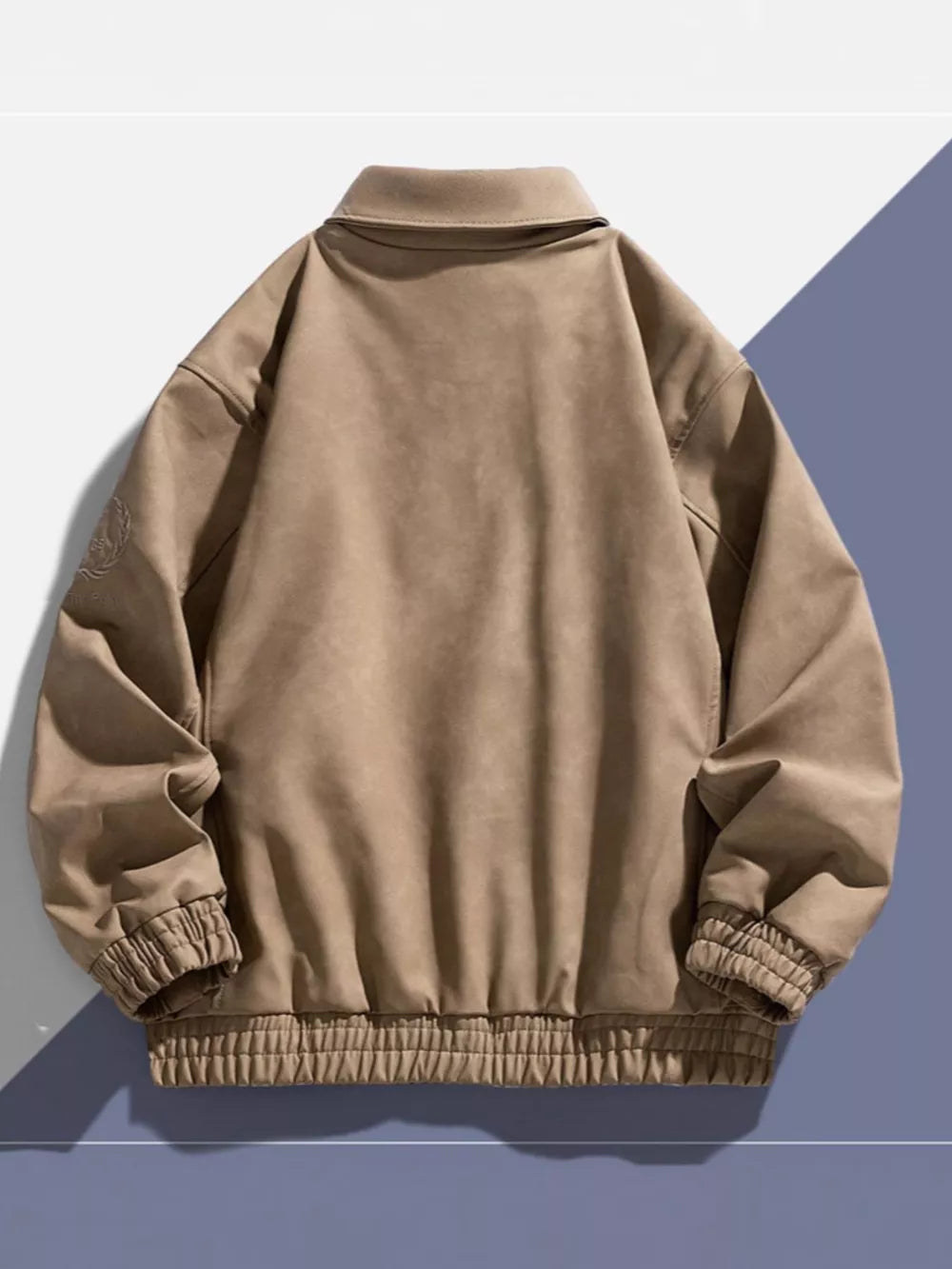 Khaki bomber jacket with classic collar, elastic cuffs, and embroidered detail on sleeve.