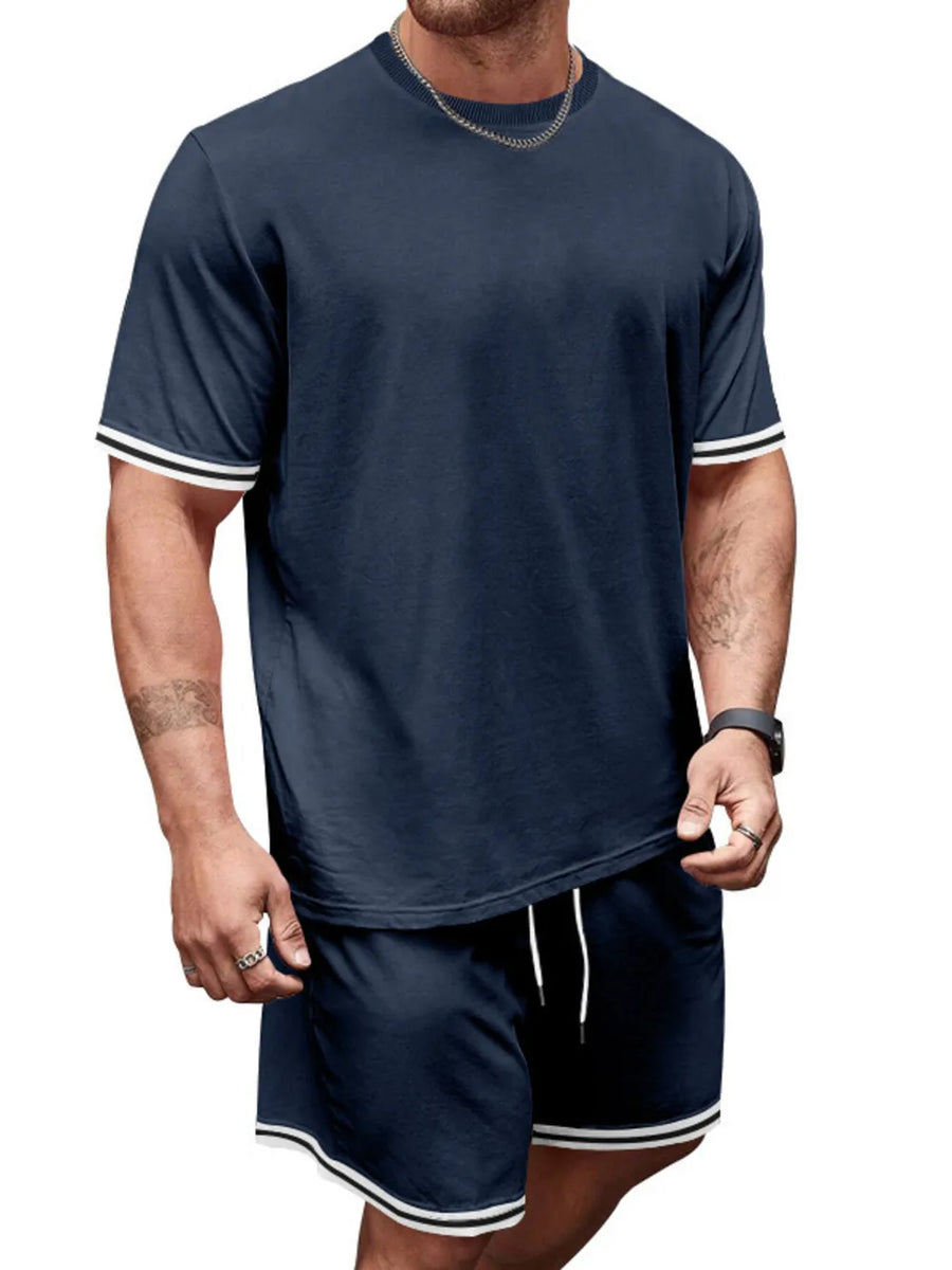 Navy blue t-shirt and shorts set with white striped trim on sleeves and shorts hem.