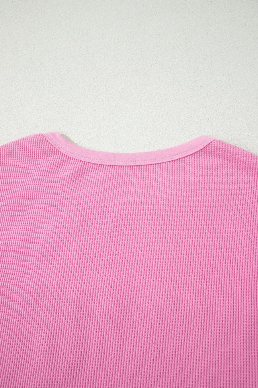 Pink waffle knit t-shirt with crew neck and pocket detail