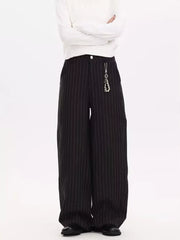 Black pinstripe wide-leg sweatpants with a pearl charm detail on the hip.