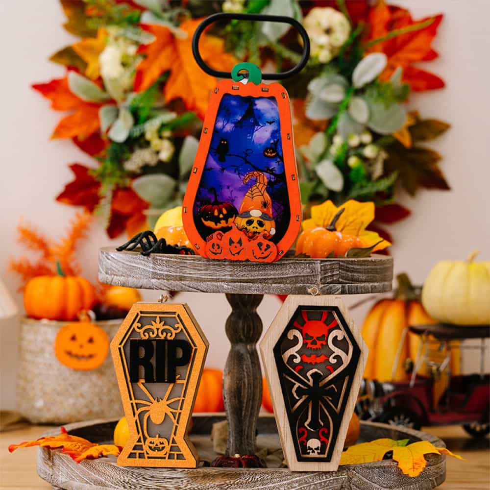 Spooky Silhouette Lantern Trio ornaments, including a pumpkin lantern and two coffin-shaped ornaments with RIP and skull
