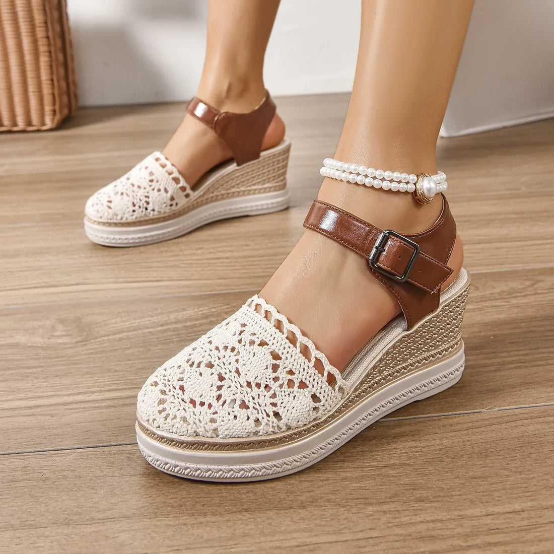 Beige crochet and leather wedge ankle strap sandals with espadrille detail.
