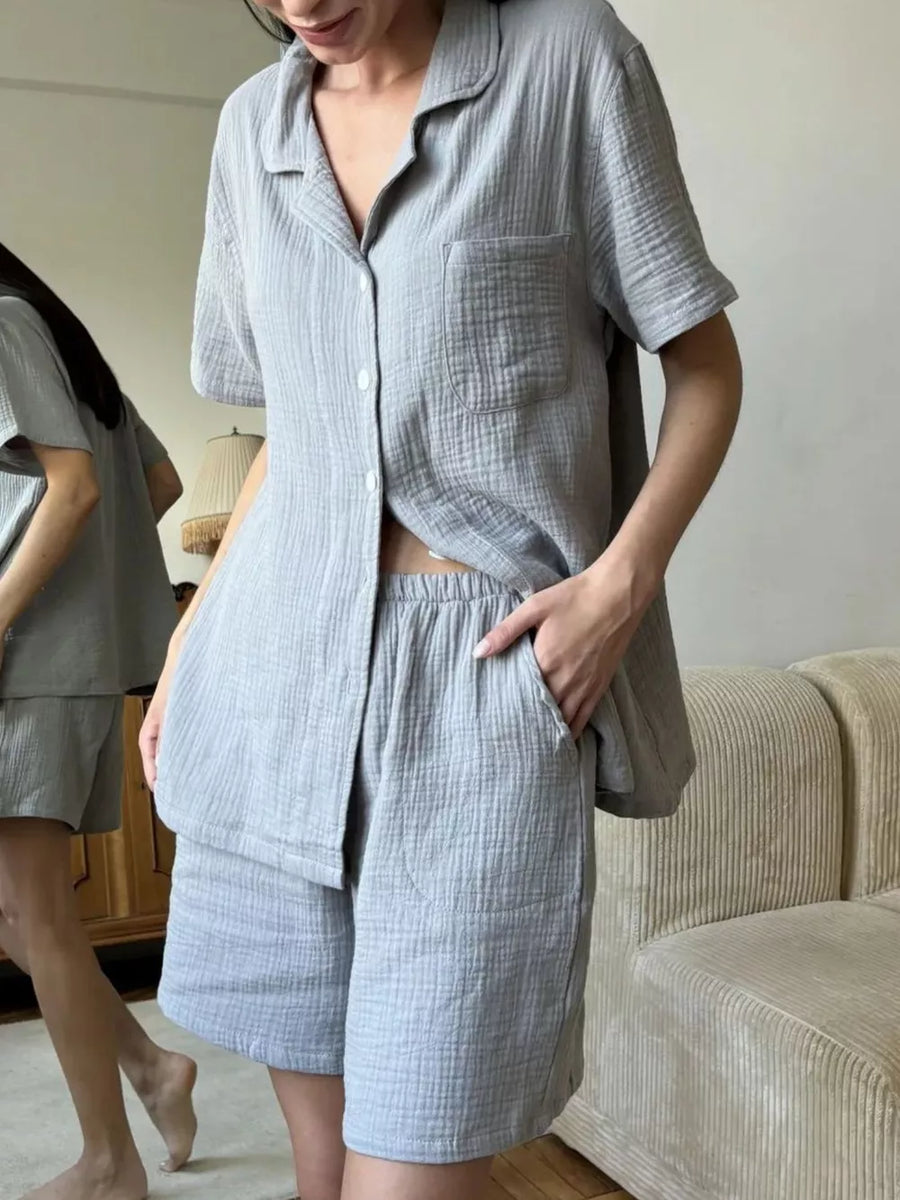 Gray cotton button-up shirt and shorts pajama set with collared neckline and chest pocket.