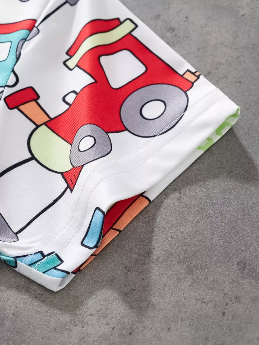 White t-shirt with colorful train print and short sleeves.