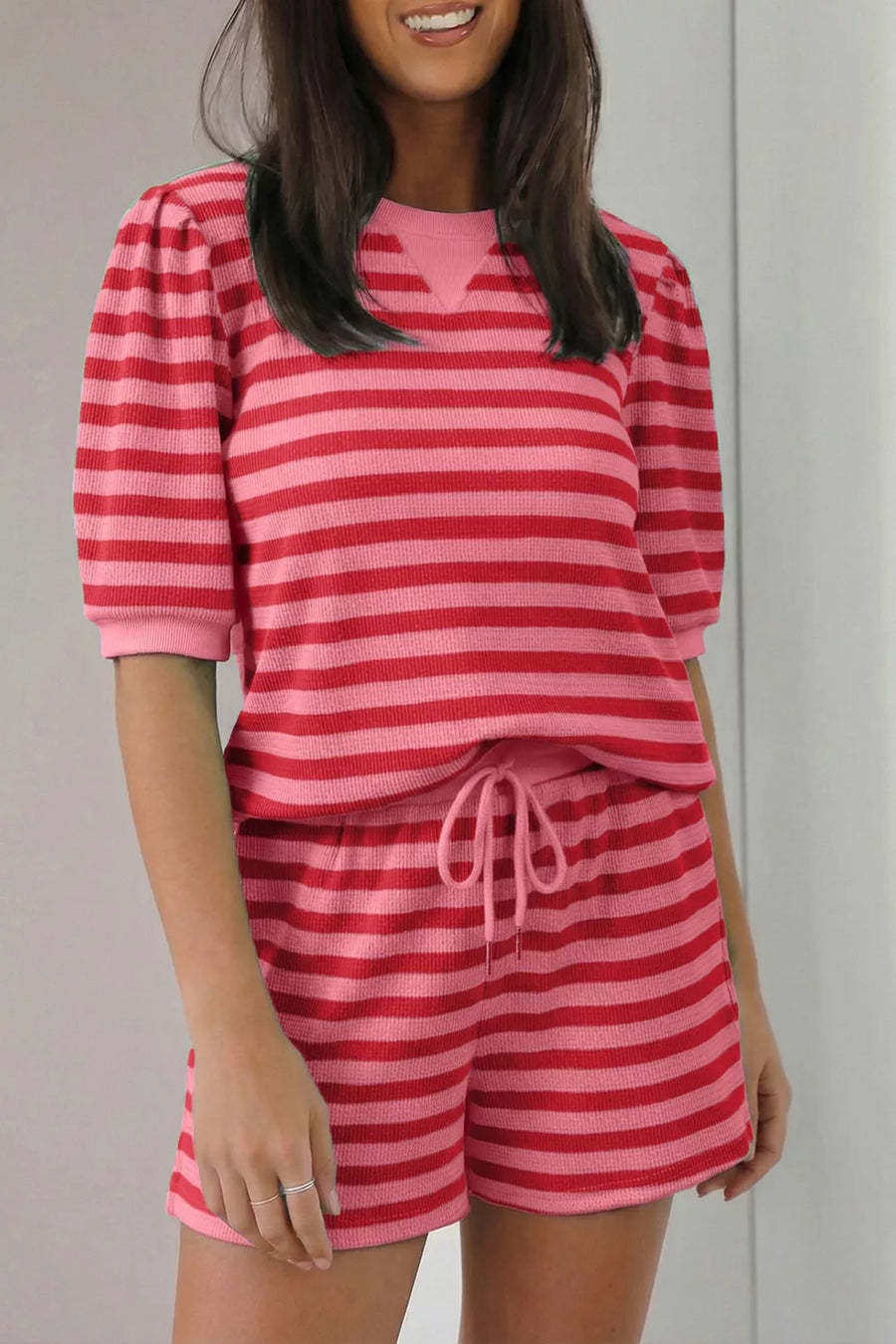 Puffed sleeve striped two-piece set in strawberry pink with drawstring shorts.