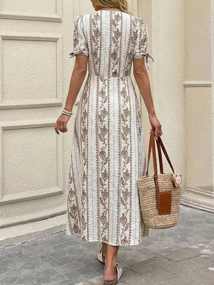 Printed button-down midi dress with tie sleeves and a-line cut.