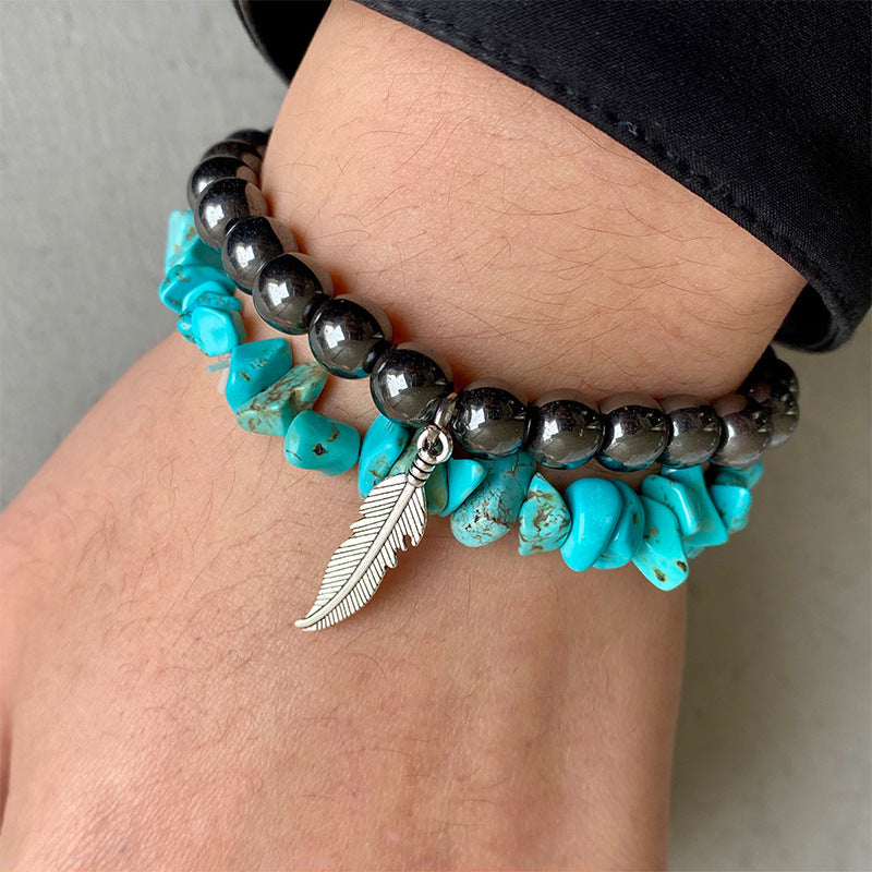 Hematite and turquoise stacked bracelet with feather charm