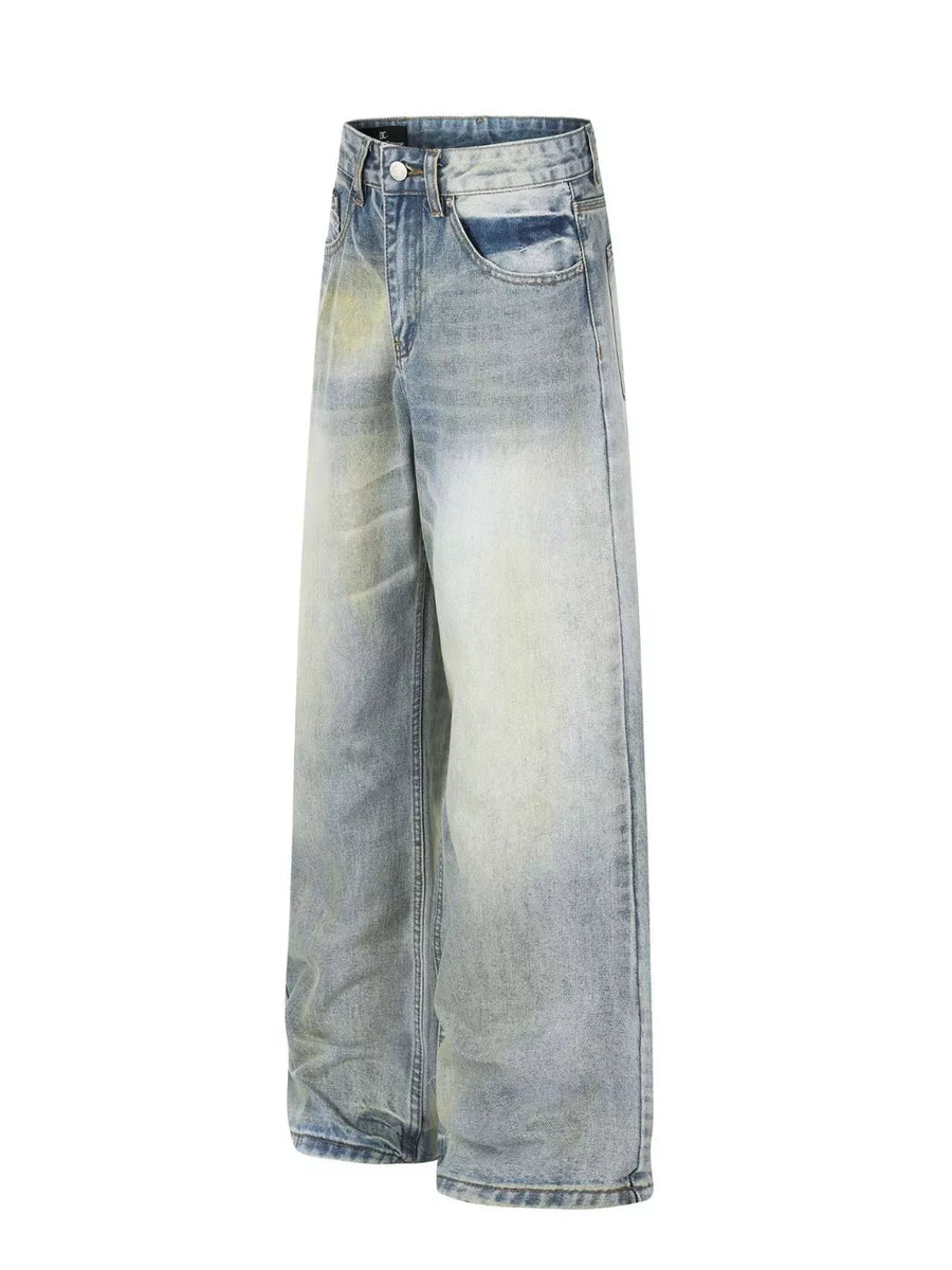 Men's light blue wide leg denim jeans with vintage wash and distressed details.
