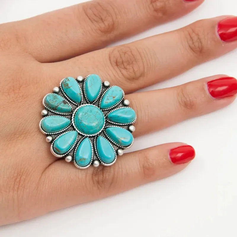 Turquoise blossom statement ring with alloy setting.