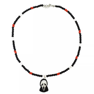 necklace in white with character-motif and beaded