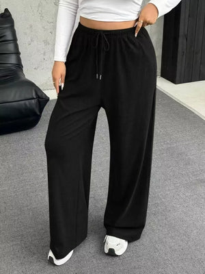 Black drawstring wide-leg maternity pants with a comfortable fit.