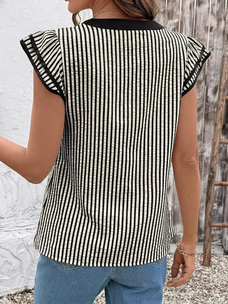 Black and white vertical stripe blouse with ruffle sleeves and a black neckline.