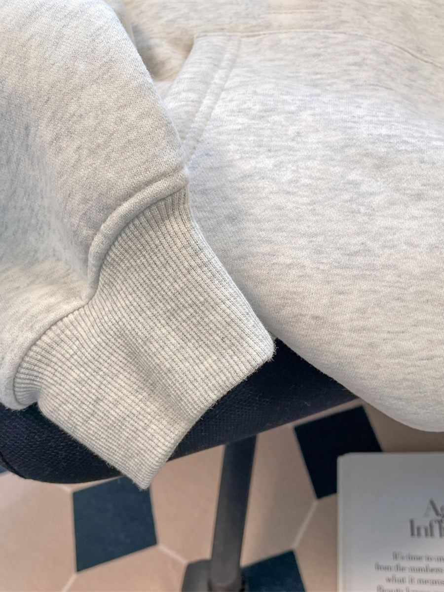 100% polyester Care instructions: Machine wash cold pullover hoodie in Black with oversized silhouette