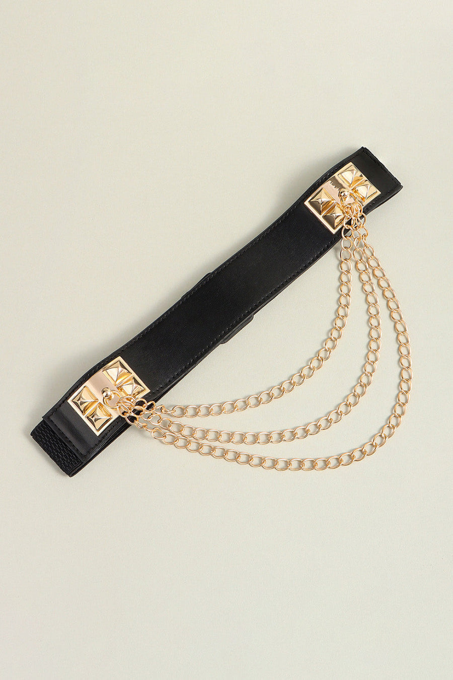Black elastic belt with gold spiked studs and layered chain detail