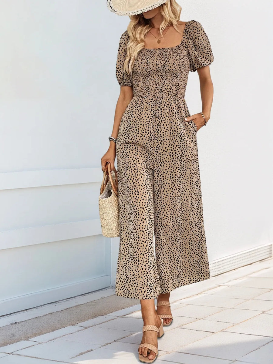 Smocked bodice leopard print jumpsuit with square neck and puff sleeves in tan.
