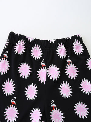 Black baby shorts with pink floral and flamingo print
