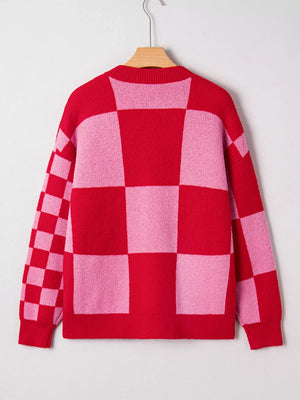 Checkerboard knit cardigan in deep rose and pink with a crew neck.