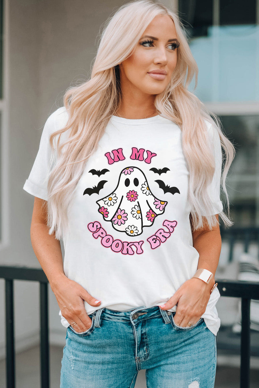 White graphic tee with a floral ghost and bats, reading In My Spooky Era.